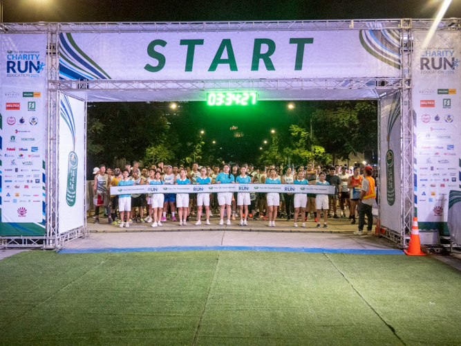Tzu Chi scholars man the start area as eager 10K Kind Runners prepare to begin the race.