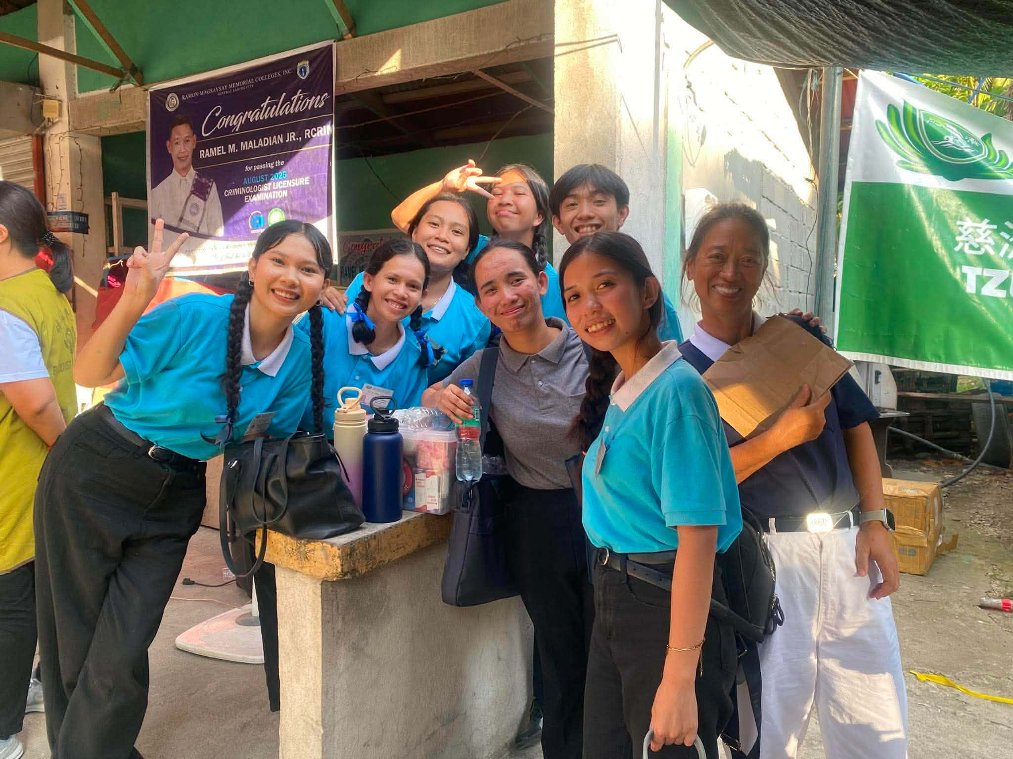 (Second from left) Happy to help beneficiaries in a relief operation in Jose Abad Santos / Photo courtesy of Mira Pondol