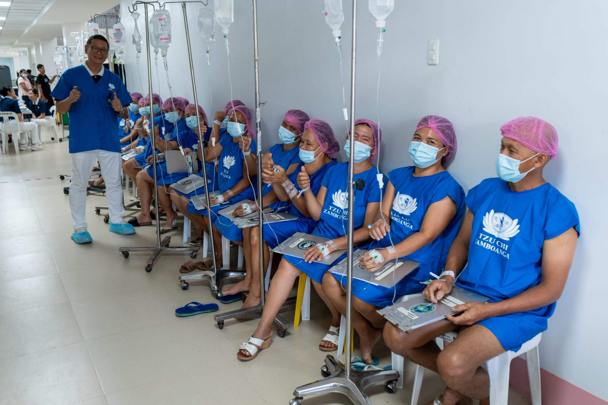 Patients scheduled for surgery patiently wait in line before undergoing their procedures.