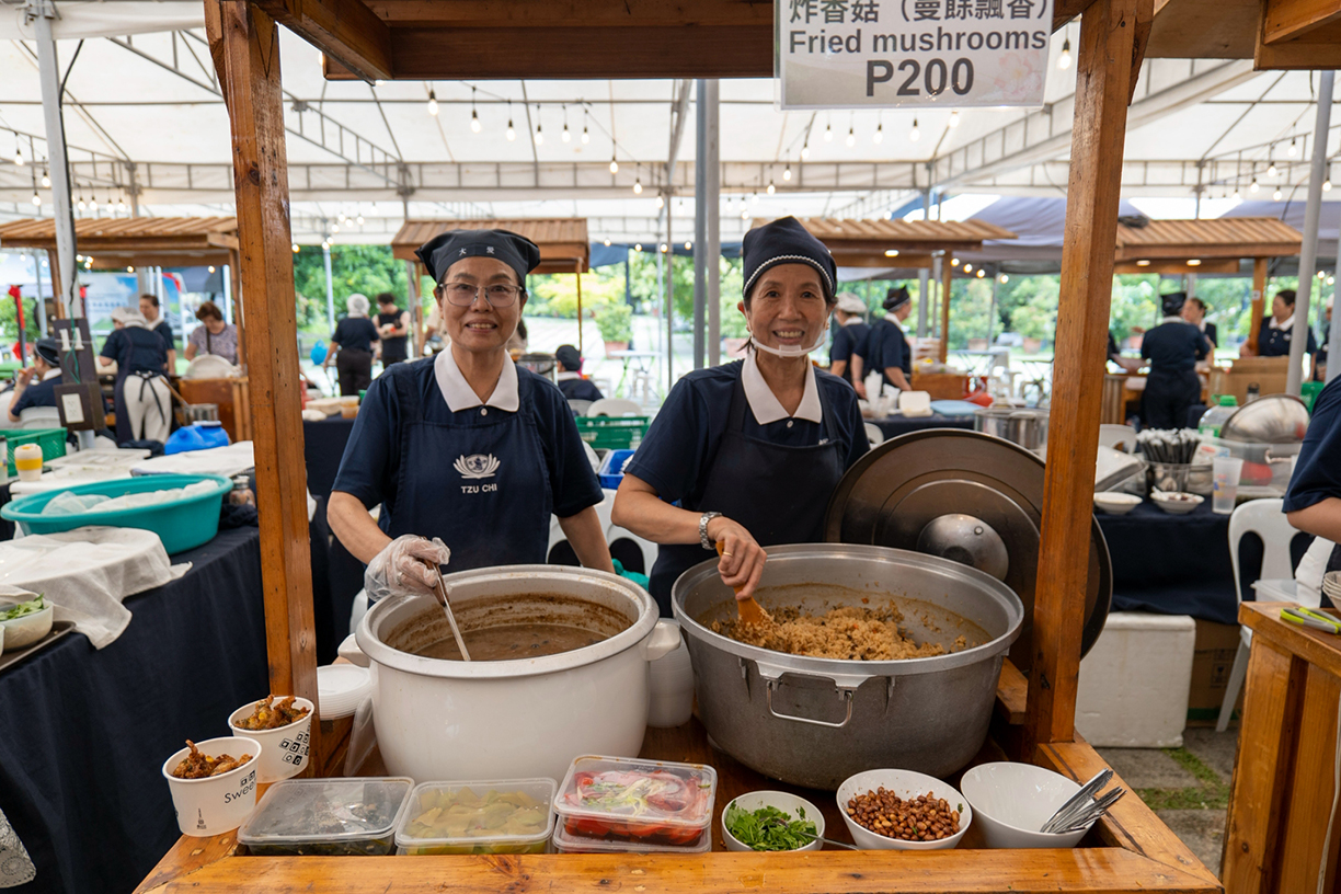 Serving up smiles and flavor, volunteer vendors happily dish out their crowd-pleasing signature style of fried rice and fried mushrooms. 