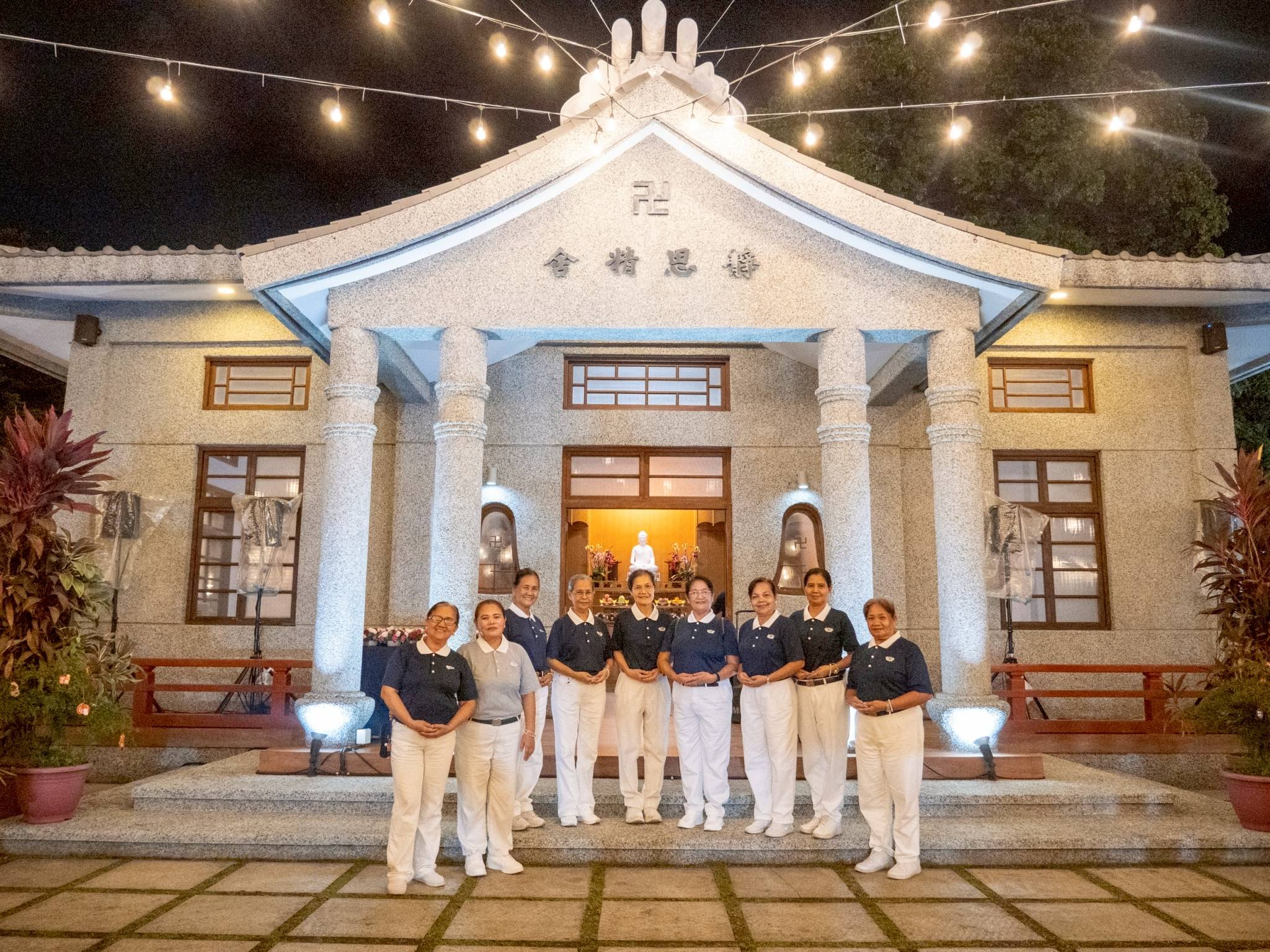 Tzu Chi Volunteers gather for a picture outside the Jing Si Abode.