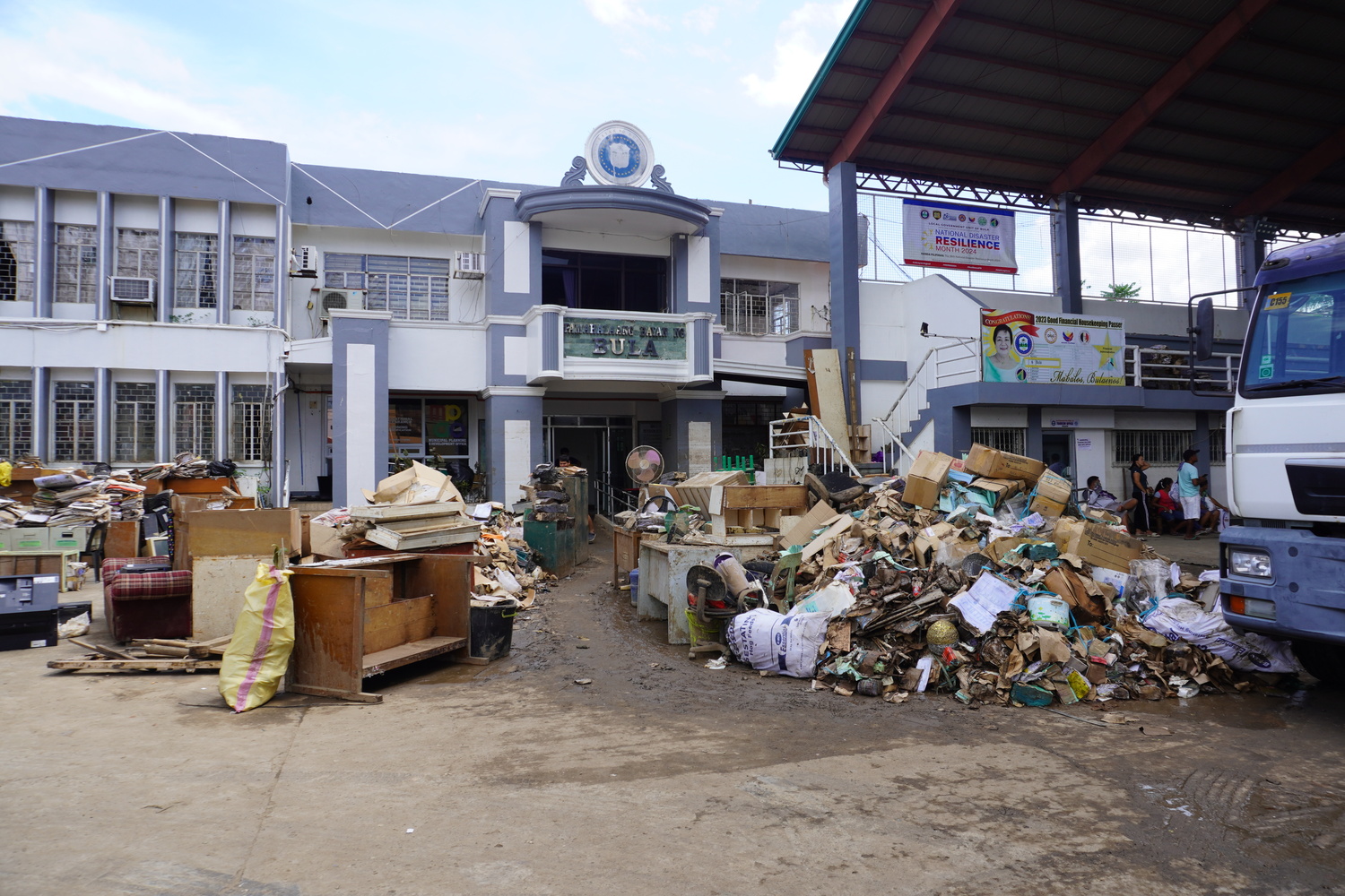 Outside the Municipal Hall of Bula, Camarines Sur, many items damaged by the typhoon were collected and set aside.