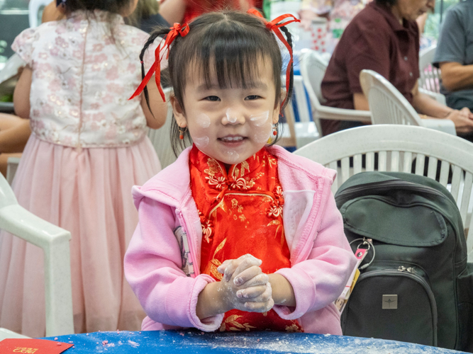 Preschoolers show up sporting their best Chinese attire. 