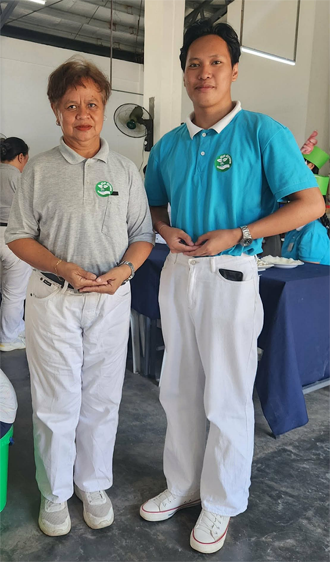 Mark Kent Cabradilla (right) shares a proud moment with a volunteer during Earth Day.