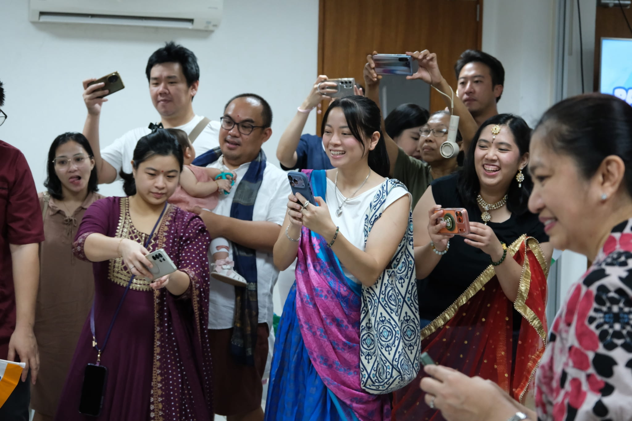 Parents are also dressed up in colorful traditional costumes and excitedly await the parade of nations. 