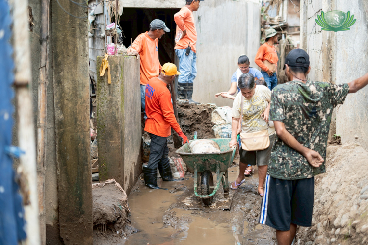 The aftermath of successive calamities remains evident, with thick mud and widespread destruction still visible across the affected areas.