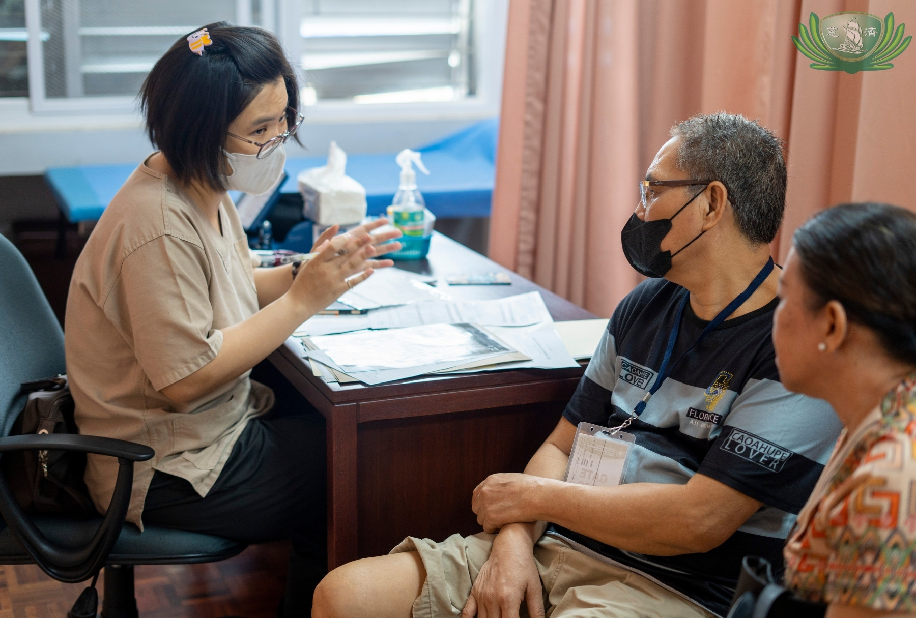 At the general medicine area, a patient undergoes a consultation with Dr. Johanna Go (left).