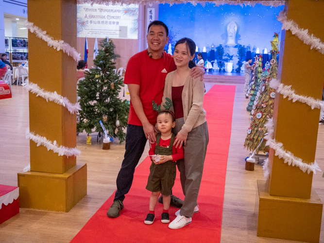 A family poses for a photo during the “Winter Wonderland: A Thanksgiving Concert.”