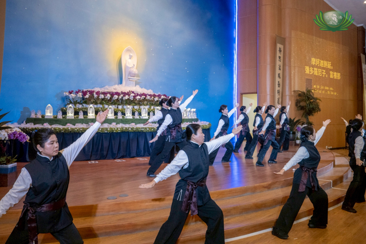 At the start of the program, volunteers combine movement and stillness in an interpretation of the Dharma chant.