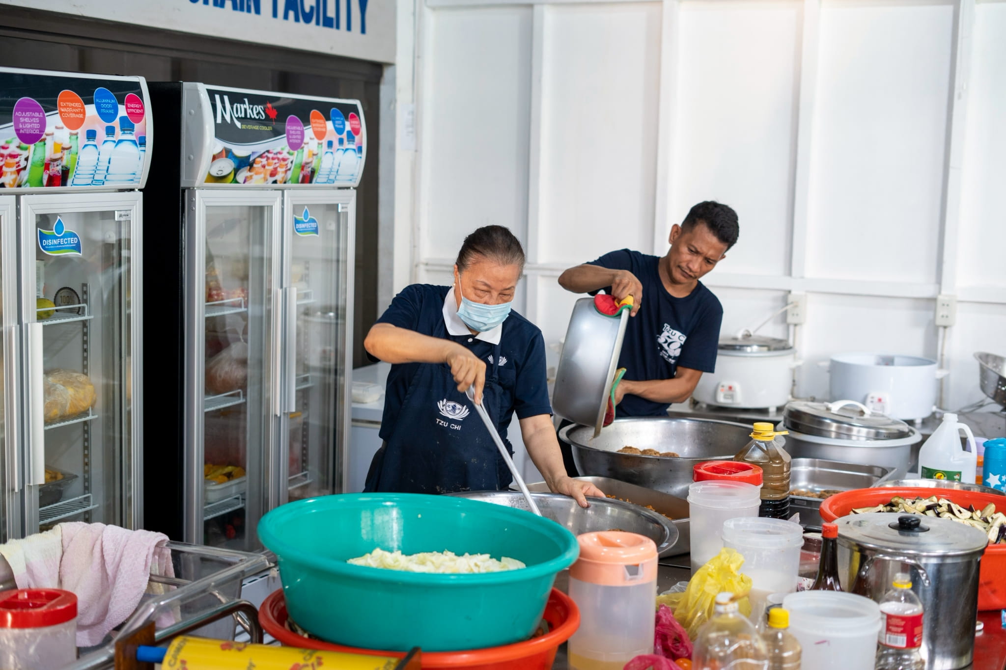 The kitchen team works tirelessly preparing delicious meals that keep everyone fueled and ready to serve.