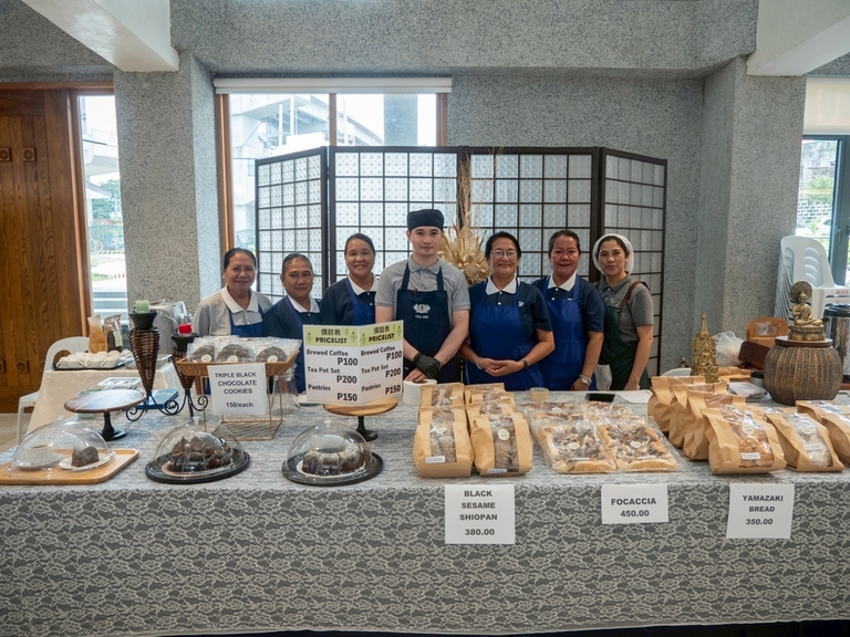 Inside Unity Hall, the bakery staff display fancy breads and other baked goods for sale.