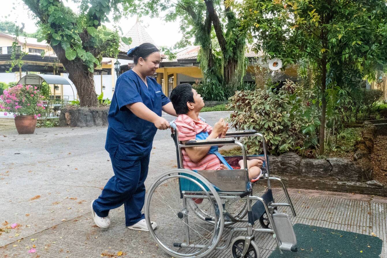 During her on-the-job training at Camillus MedHaven Nursing Home, Gemmalyn takes her wheelchair-bound patient out for some fresh air. 