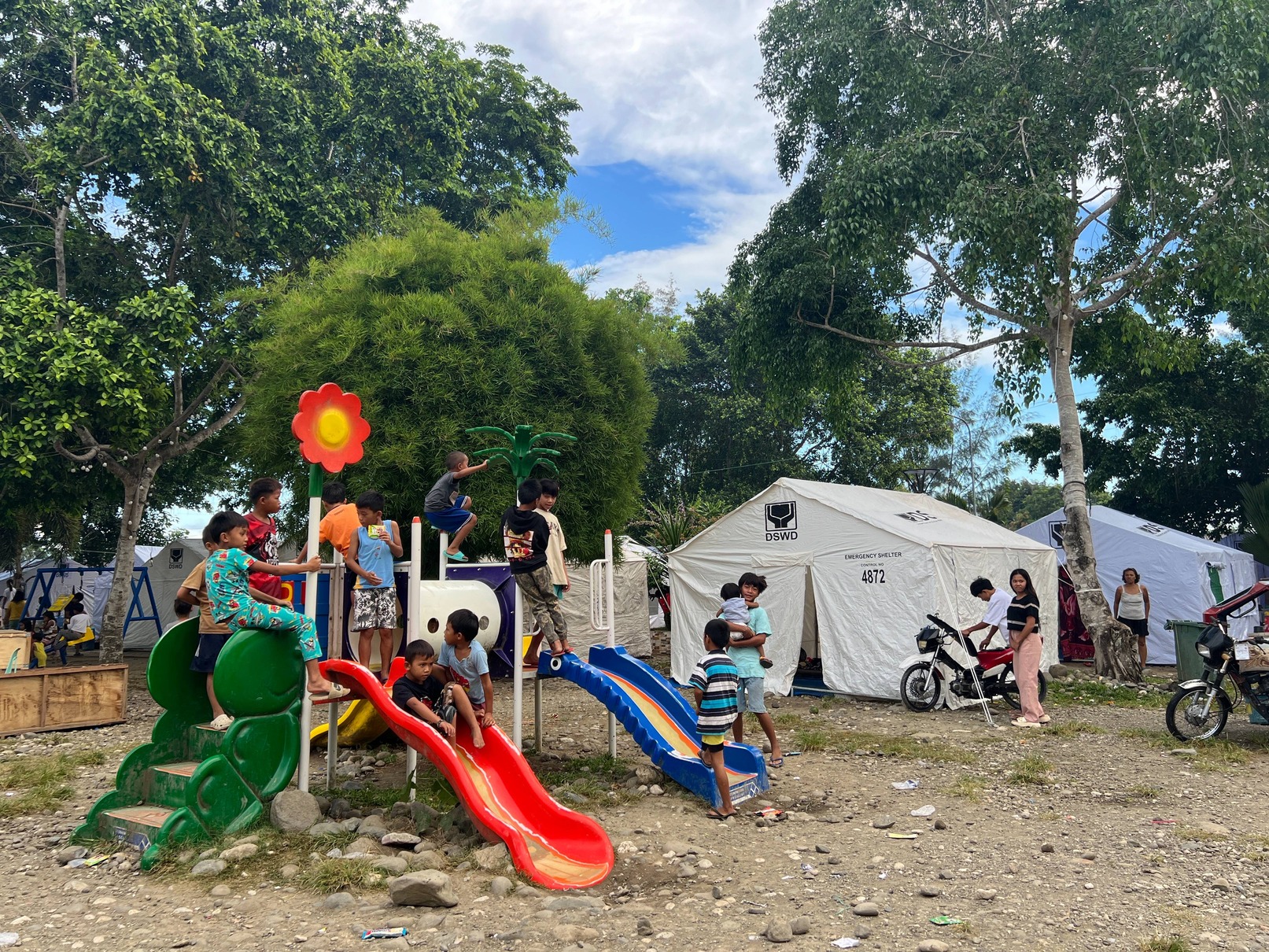 At an open-air Tent City for quake survivors in Glan, a playground allows children to forget, even for a while, about their traumatic experience with the earthquake. 