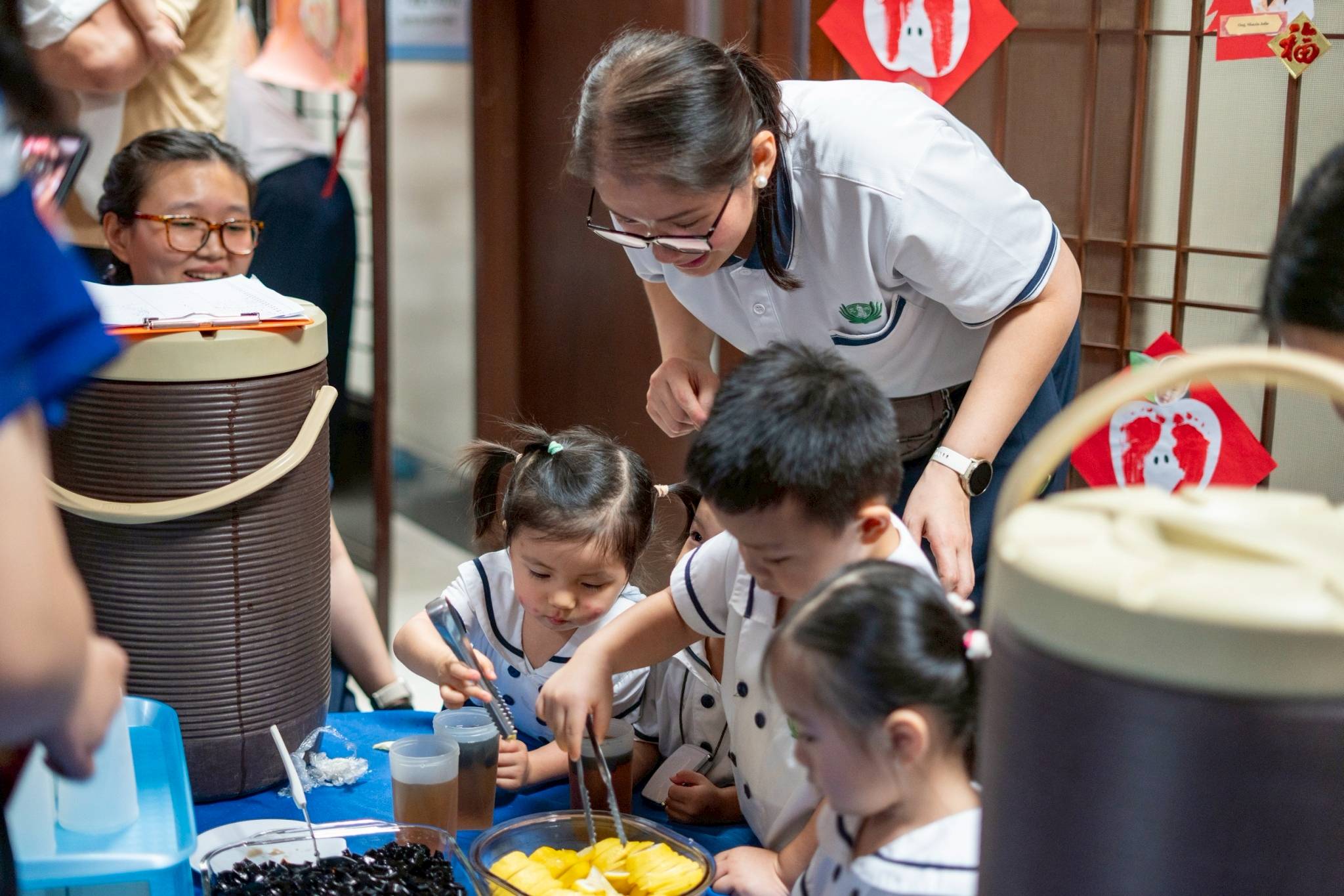 With guidance from their teachers, the children confidently carried out their roles.