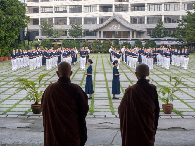 Before the sun rises, participants engage in the respectable walking meditation, led by the Dharma Masters.