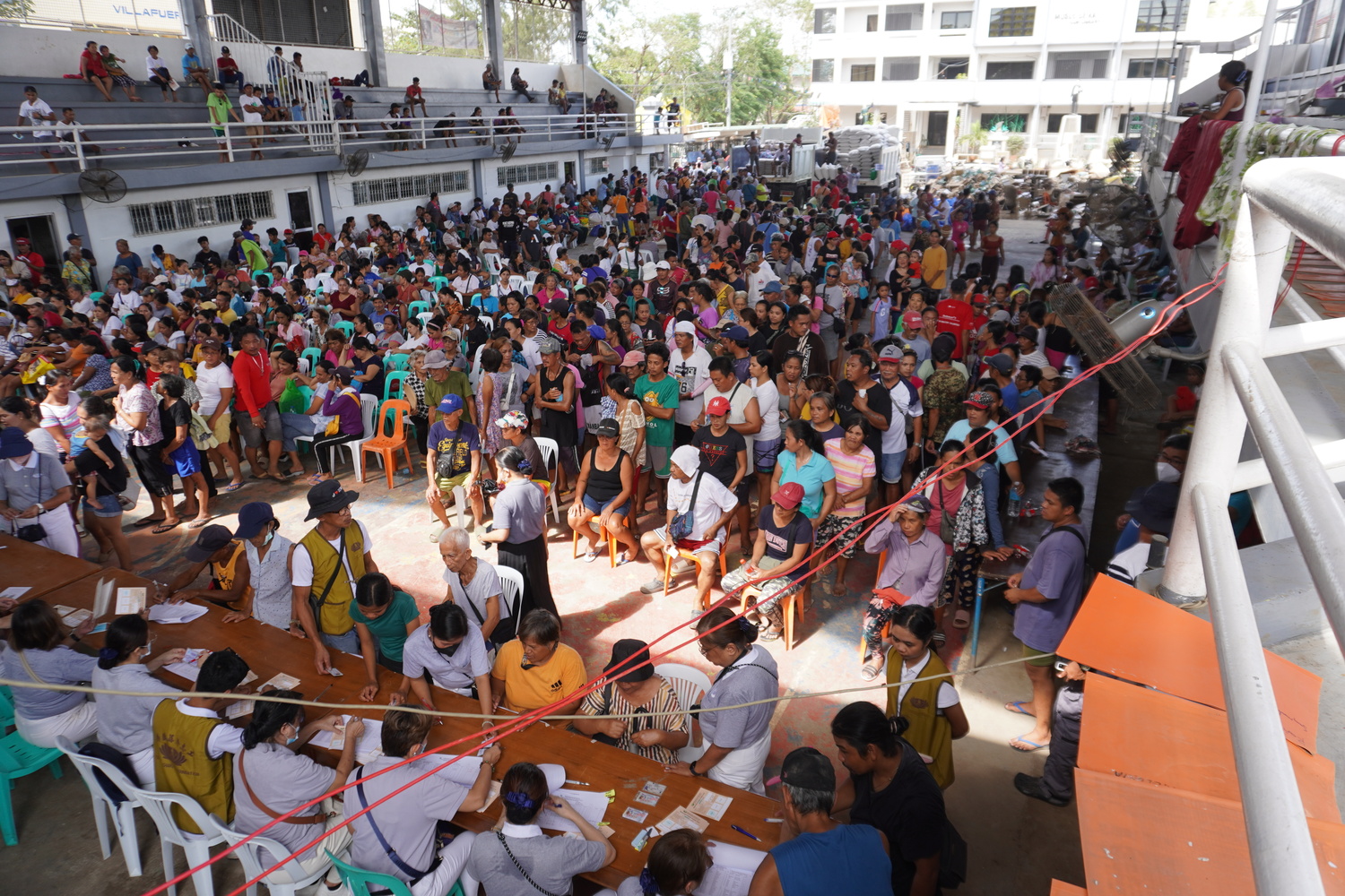 Hundreds to thousands of affected individuals line up at the stub distribution at the Municipality of San Miguel in Bula, Camarines Sur. 