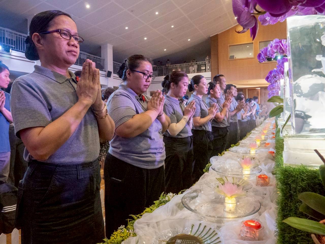 Following Tzu Chi volunteers and special guests, Tzu Chi staff take the opportunity to experience the cleansing and renewal of the Buddha Bathing Ceremony.