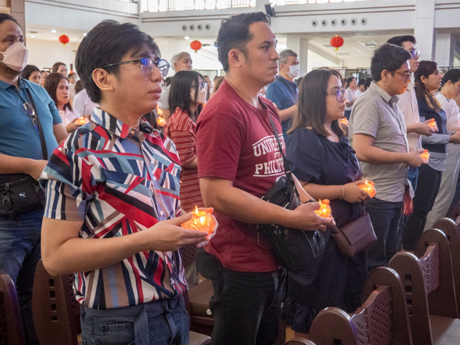 Officers from the University of the Philippines Diliman, a partner institution of Tzu Chi, participate in the ceremony’s concluding prayer.