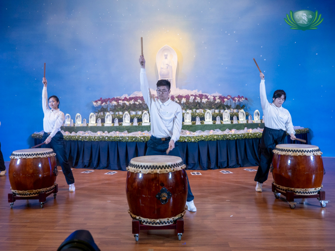 Youth volunteers deliver a rousing performance in striking the Great Dharma Drum.