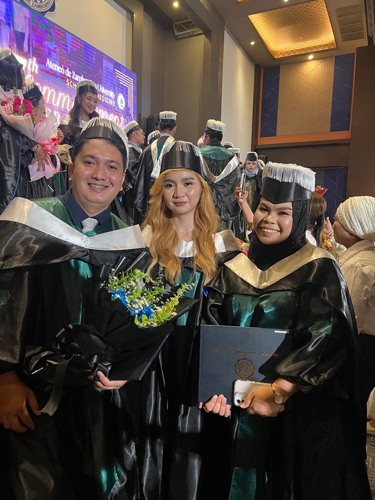 They made it! (From left), Tzu Chi scholars Edil-Joshua Perez Ganas, Andrea Bonafe Ibañez, and Rizma Kila Uckung-Luy graduate from Ateneo de Zamboanga University’s School of Medicine. 