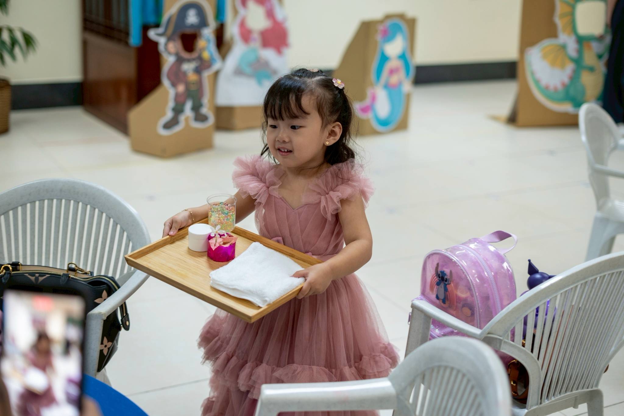 Excitement filled the room as the little ones were about to treat mommies to a special treat.