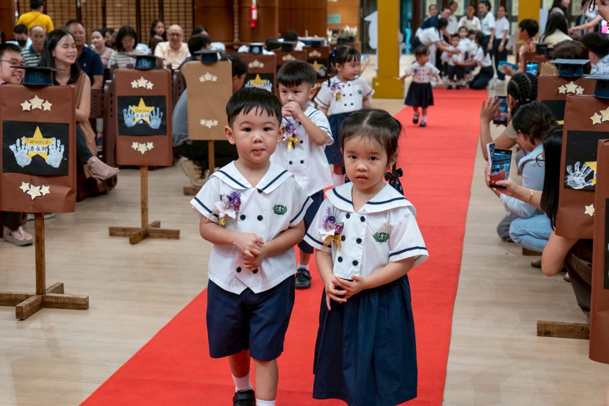 Nursery students from the AM and PM classes walk the red carpet too. 