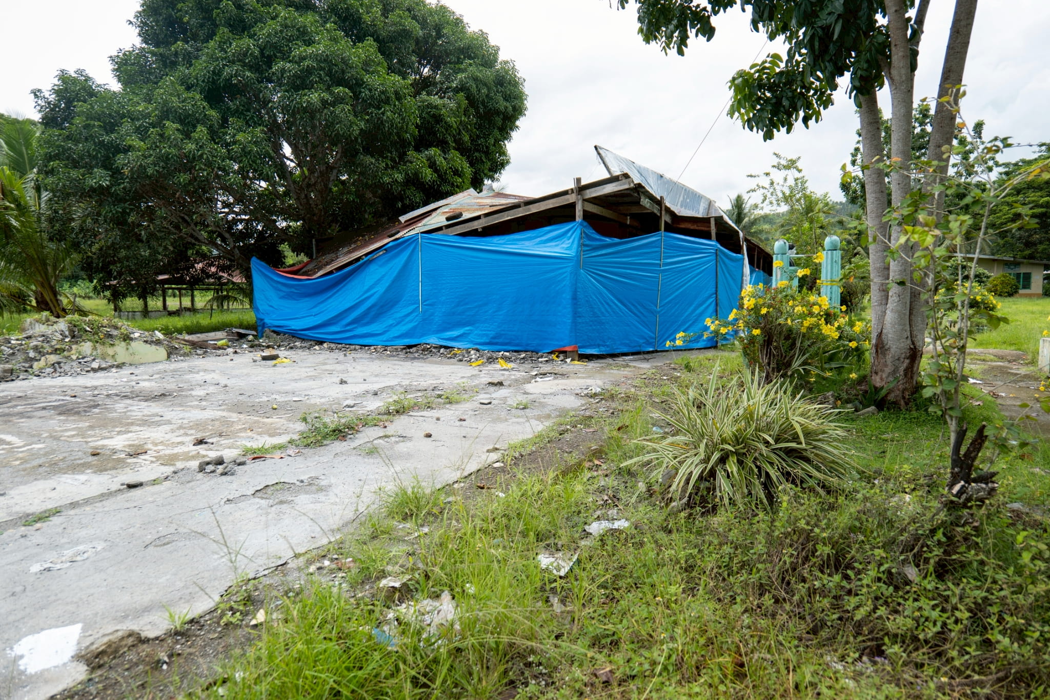 Classrooms once stood in this space but now only demolished structures remain after the buildings were totally damaged by the earthquake.