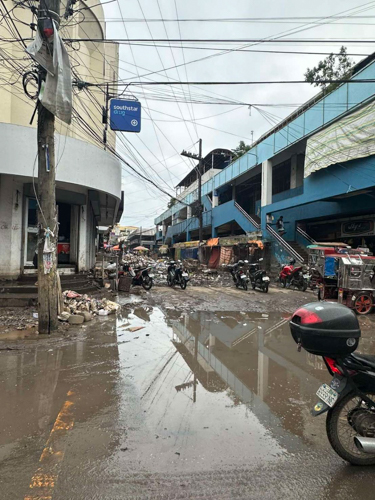 Still in Bula, Camarines Sur, roads remain wet, muddy, and filled with debris. 