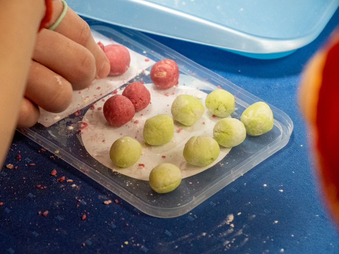 Creating glutinous rice balls (tang yuan) was an activity that encouraged a preschooler to participate and bond with his parents. The sticky balls are a symbol of prosperity and strong family ties. 