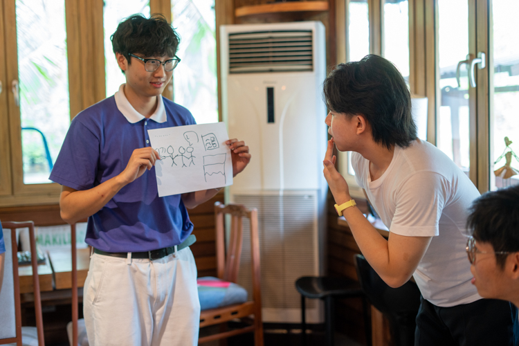 At the Creative Drawing Relay station, team members have just five seconds each to contribute to a collaborative artwork before passing the paper to the next person.