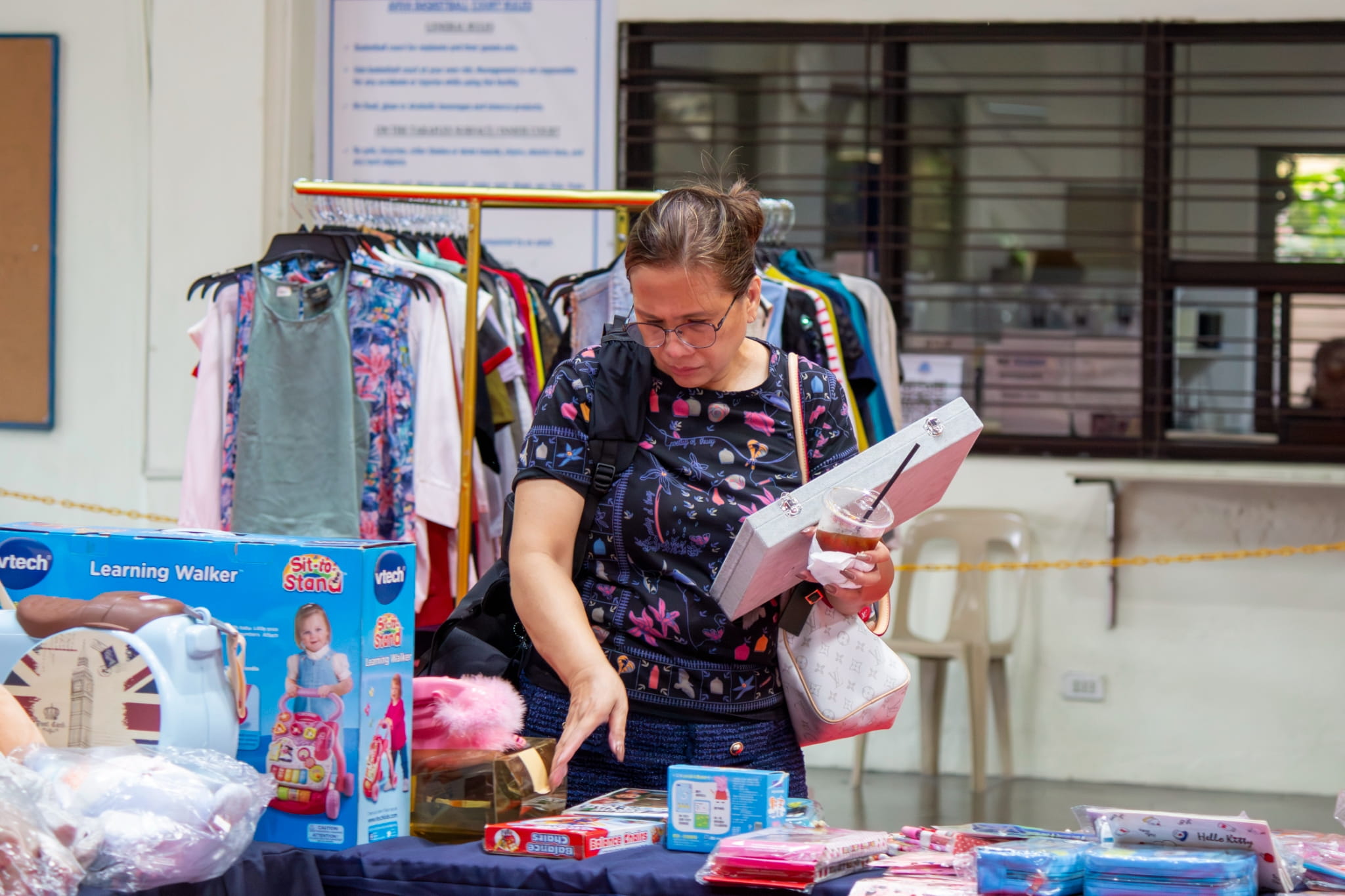 Shopper Imee Gines spends the day hunting for pre-loved finds at the charity bazaar. 