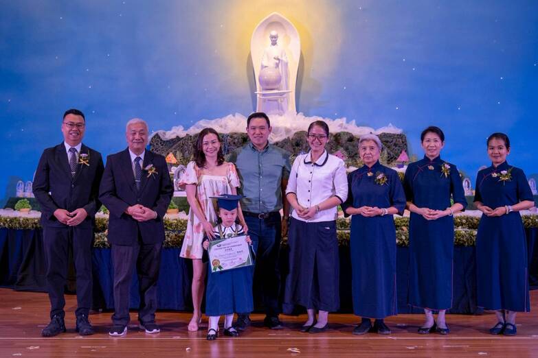 Sheena and Mark Tan (third and fourth from left) are pleased that daughter Harper has become more sensitive and compassionate to others.