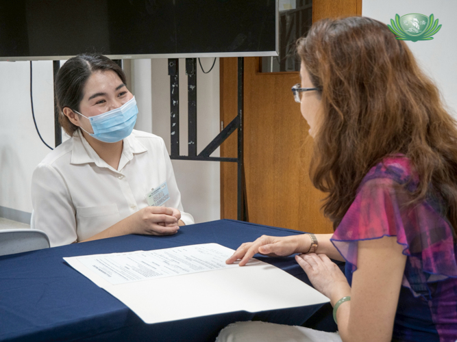 Tzu Chi scholar Kyla Salido (left) gives her best in the mock interview.
