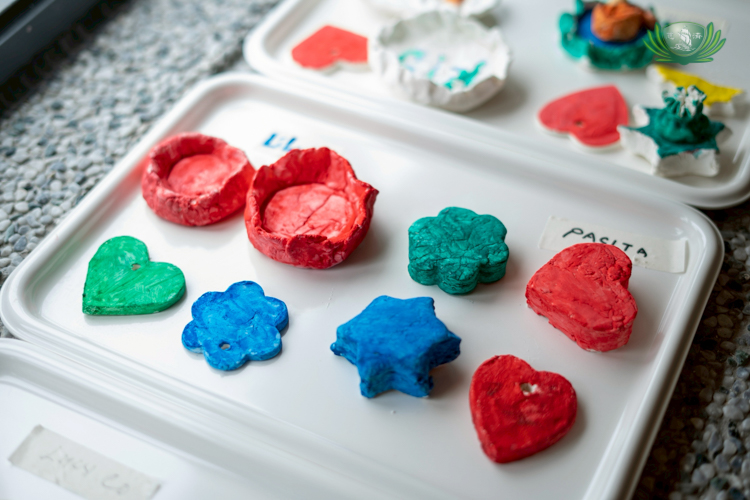 Painting shapes made from cornstarch and baking soda requires seniors to hold the shape with one hand and a paintbrush in another.