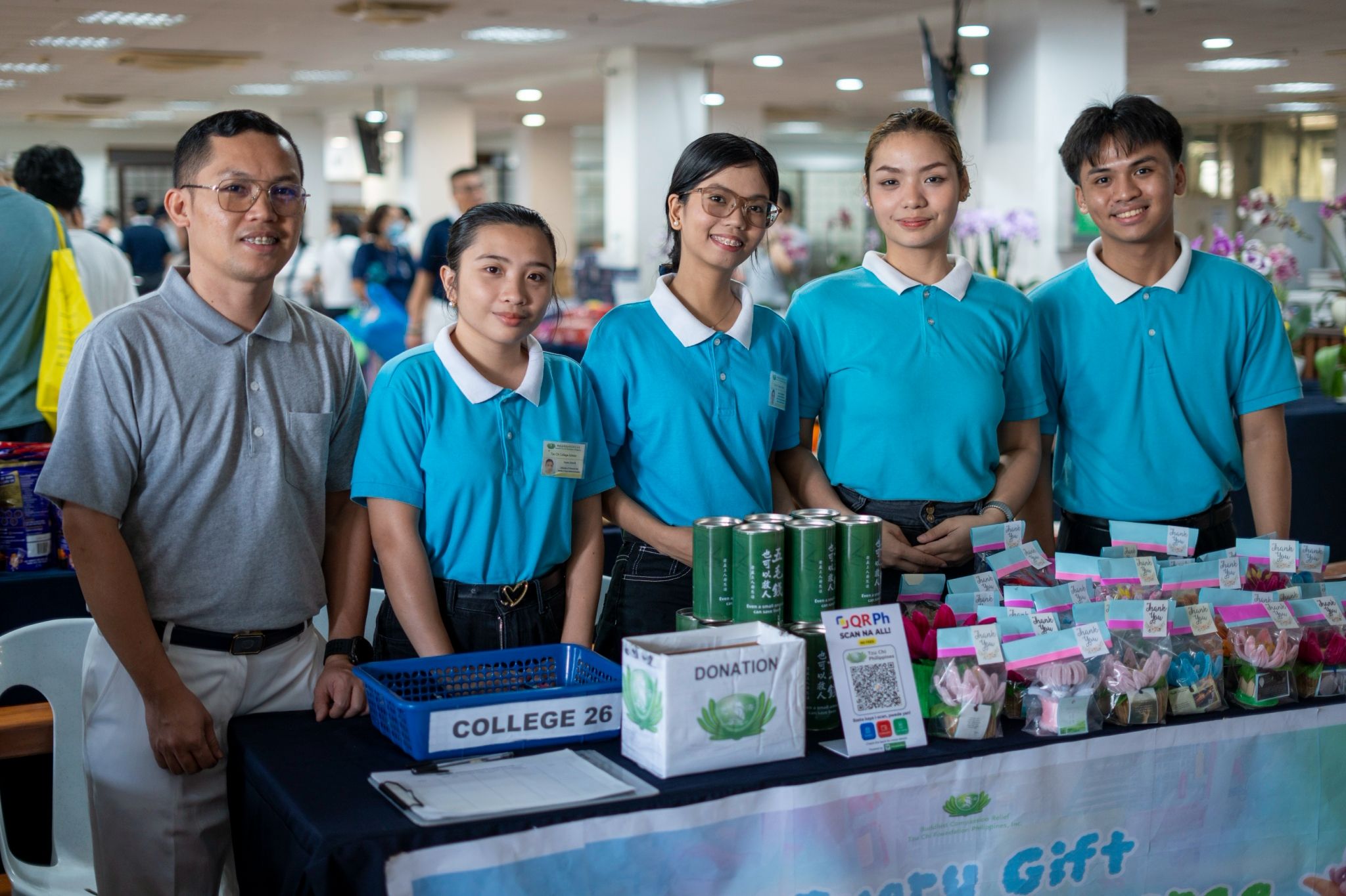 (From left) Tzu Chi volunteer Jaynard Jasmin and Tzu Chi scholars Erica Cuison, Gabrielle Monera, Angelica Guballo, and Luis Christopher Sta. Maria man a table featuring novelties handcrafted from fuzzy wire. 