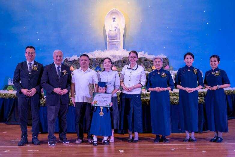 Mom Michelle Fang (fourth from left) says that daughter Olivia’s growth isn’t possible without the help and encouragement of teachers and classmates.