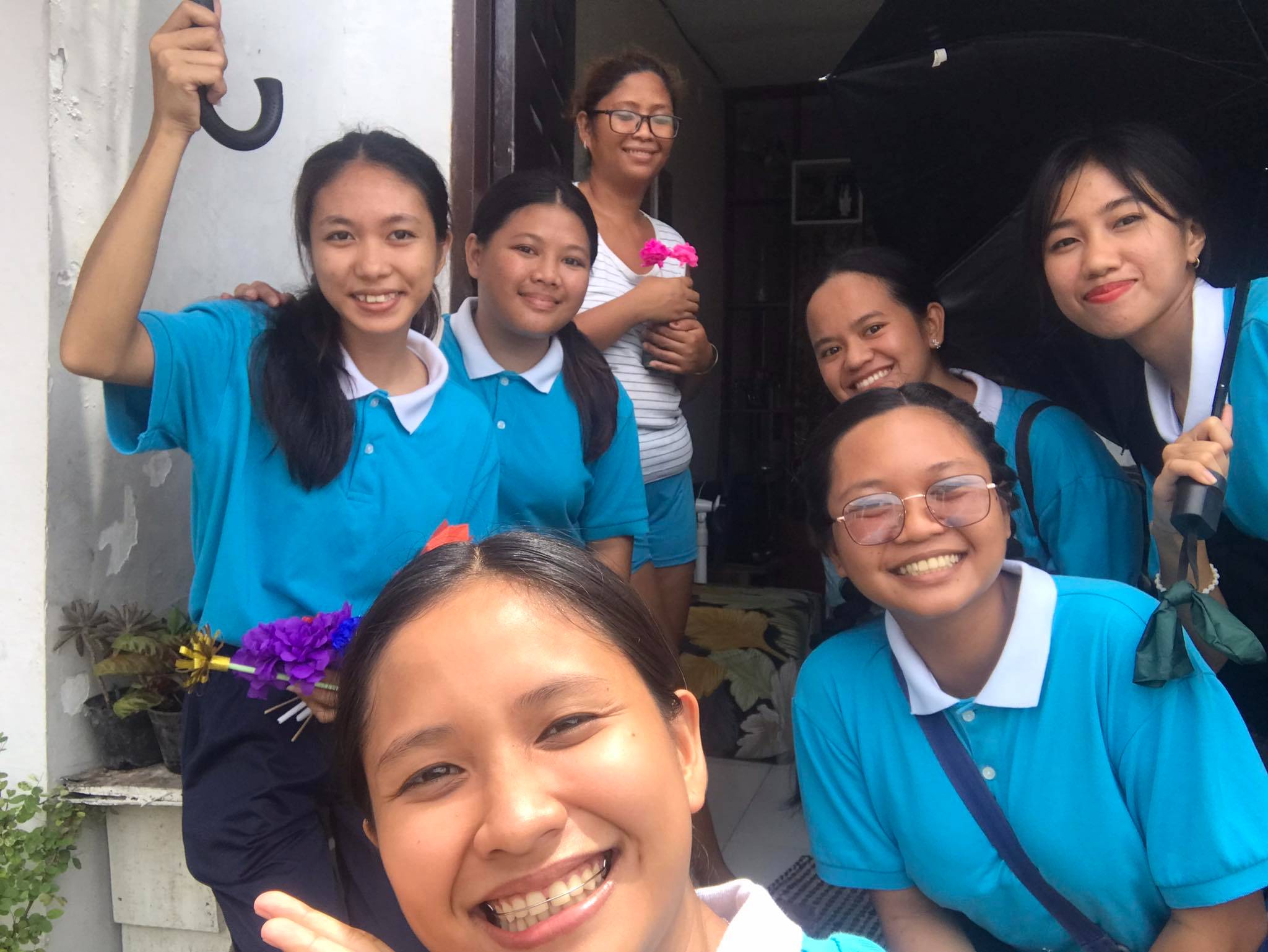 Patricia Paula Briz (second row, right) actively takes part in the monthly coin can collection at Tzu Chi Great Love Village in San Vicente, Tabaco City, Albay.