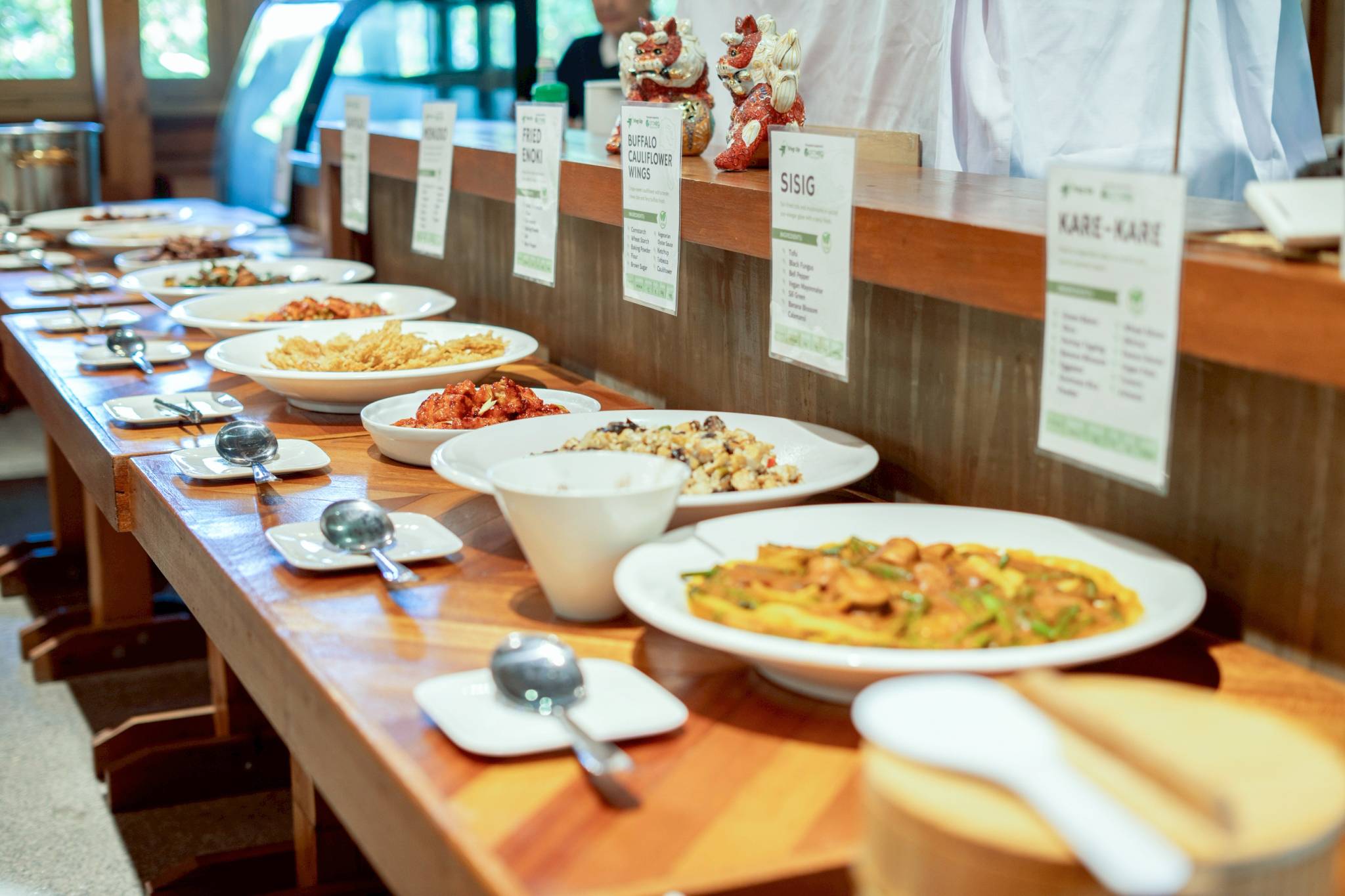 The spread highlighted Filipino favorites, including kare-kare and bistek Tagalog, complemented by entrées like tinolang buko, fried enoki mushroom, and Buffalo cauliflower wings.