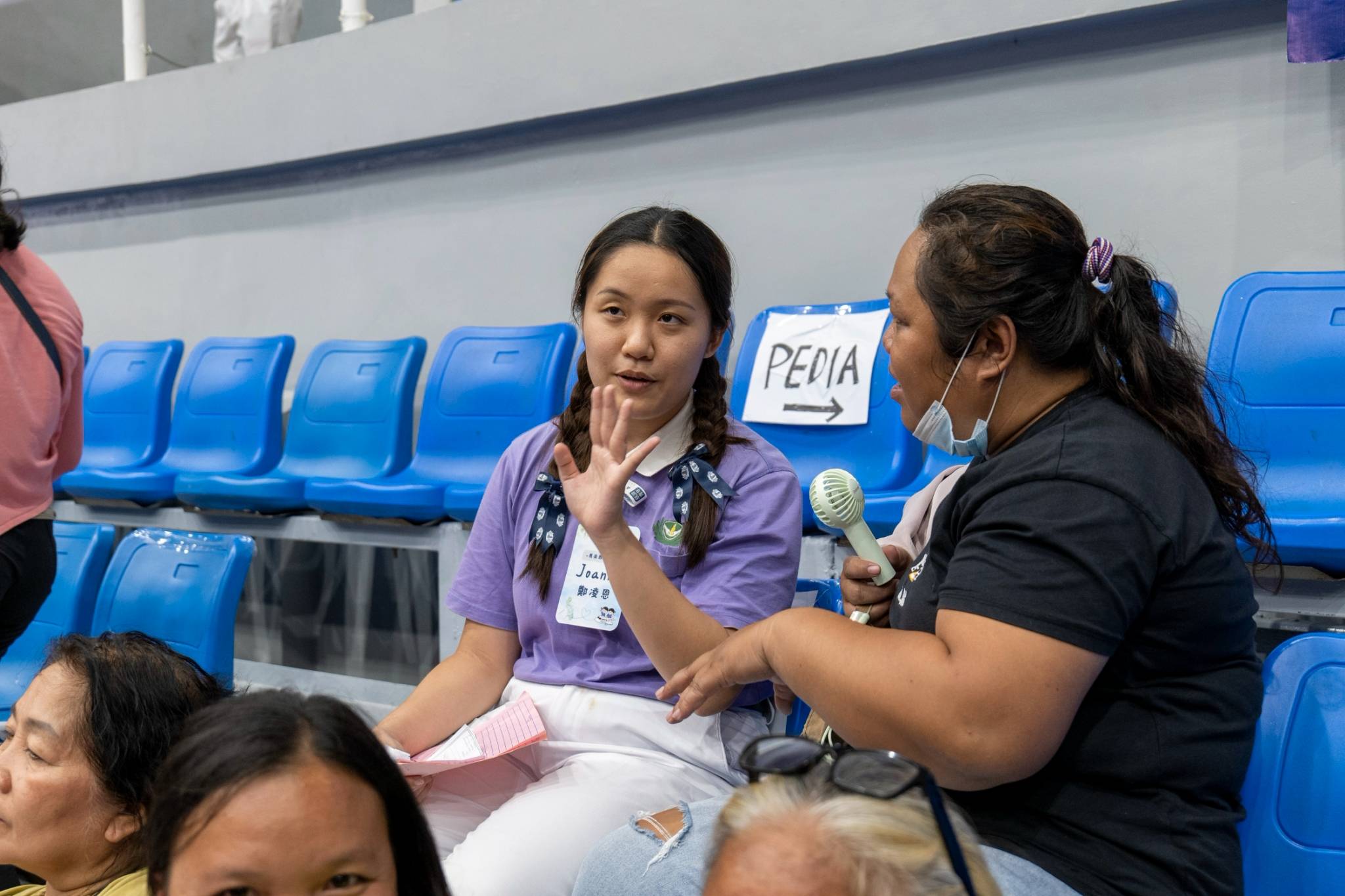 A Tzu Ching took time to explain the history of the foundation and its missions to a patient.