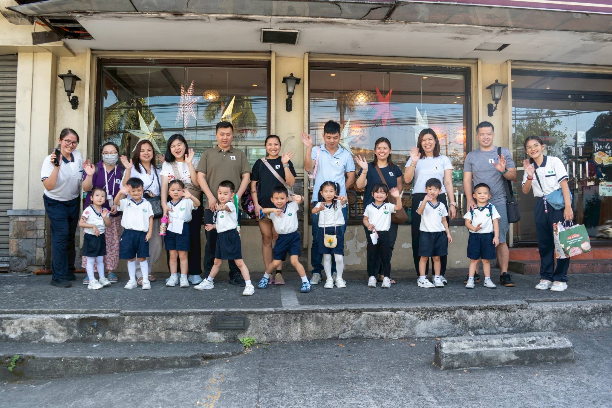 Together with their parents, the students posed for a photo in front of Pan de Manila before buying bread and pastries.