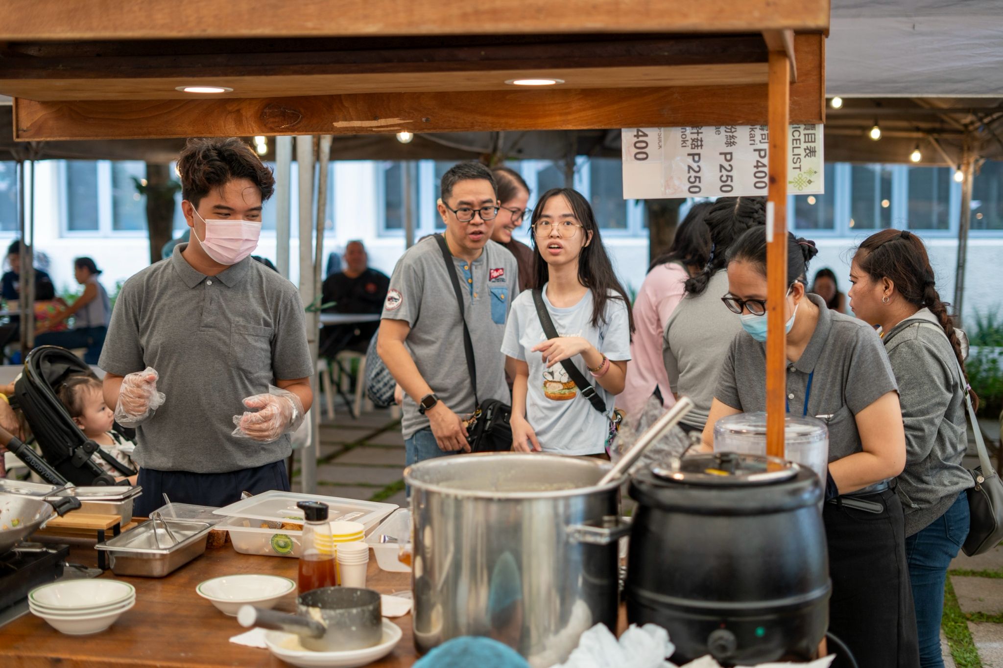 The Tzu Chi staff’s rice porridge booth brings in ₱27,825 for the fundraising effort.