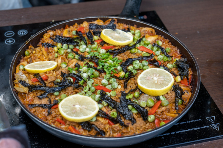 This vegan paella includes plant-based ground beef and sausage from Beyond Meat, one of the brands under Prime Pacific Foods Corporation.