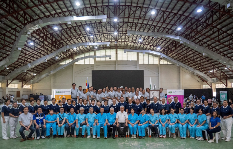 Members of the Tzu Chi International Medicine Association (TIMA) together with volunteers pose for a group shot.