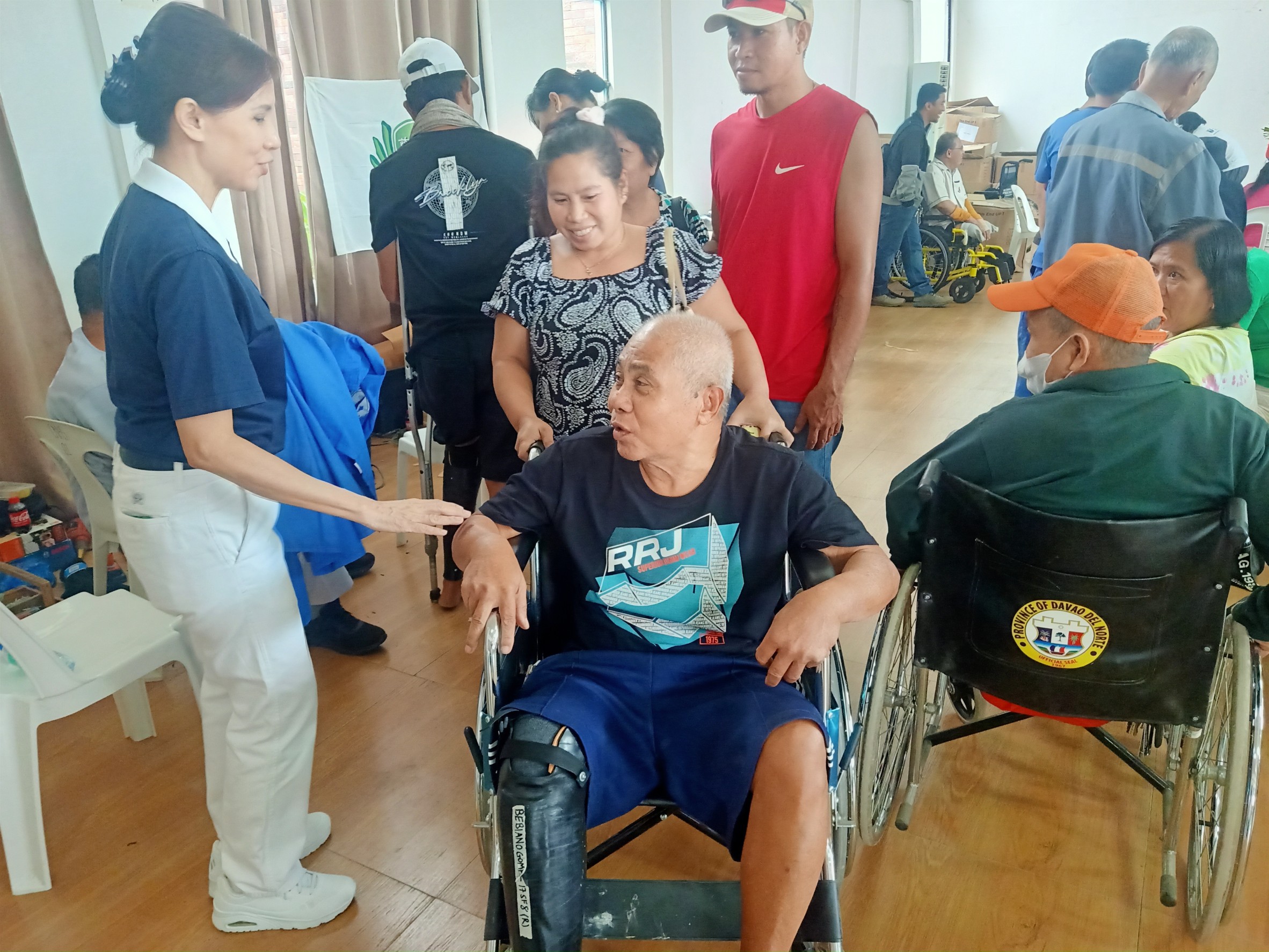 Beneficiaries are welcomed to the Jesus V. Ayala Hall of Tagum City Hall for the turnover of prosthetic limbs and wheelchairs. 