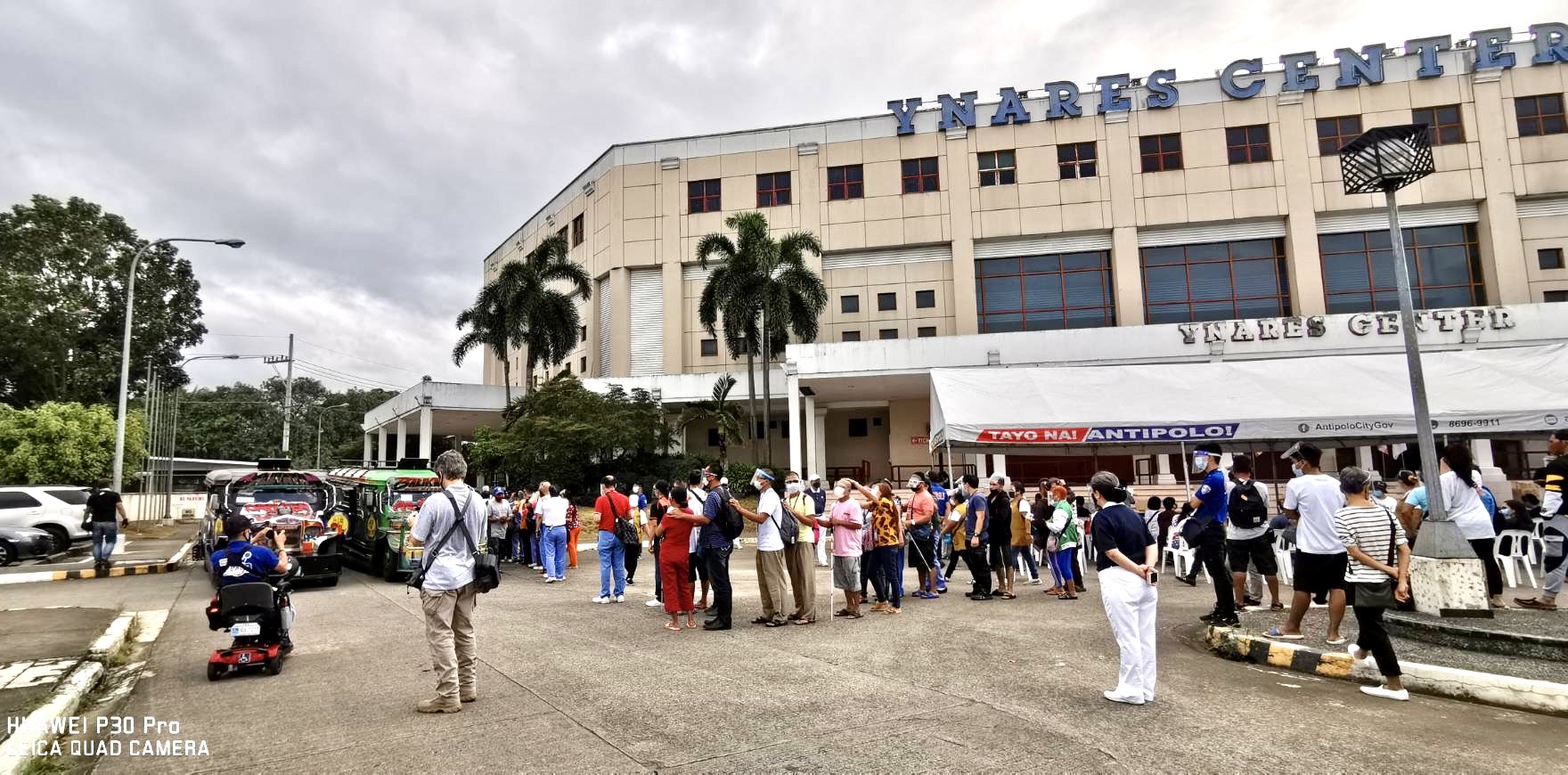 Blind massage therapists line up to claim their goods in a rice and grocery distribution organized by Tzu Chi at Antipolo’s Ynares Center in 2021.