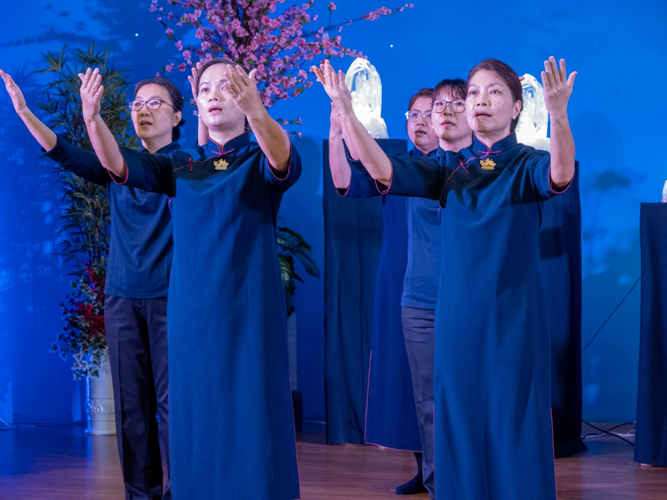 Tzu Chi commissioners perform portions of the Sutra of Immeasurable Meanings.