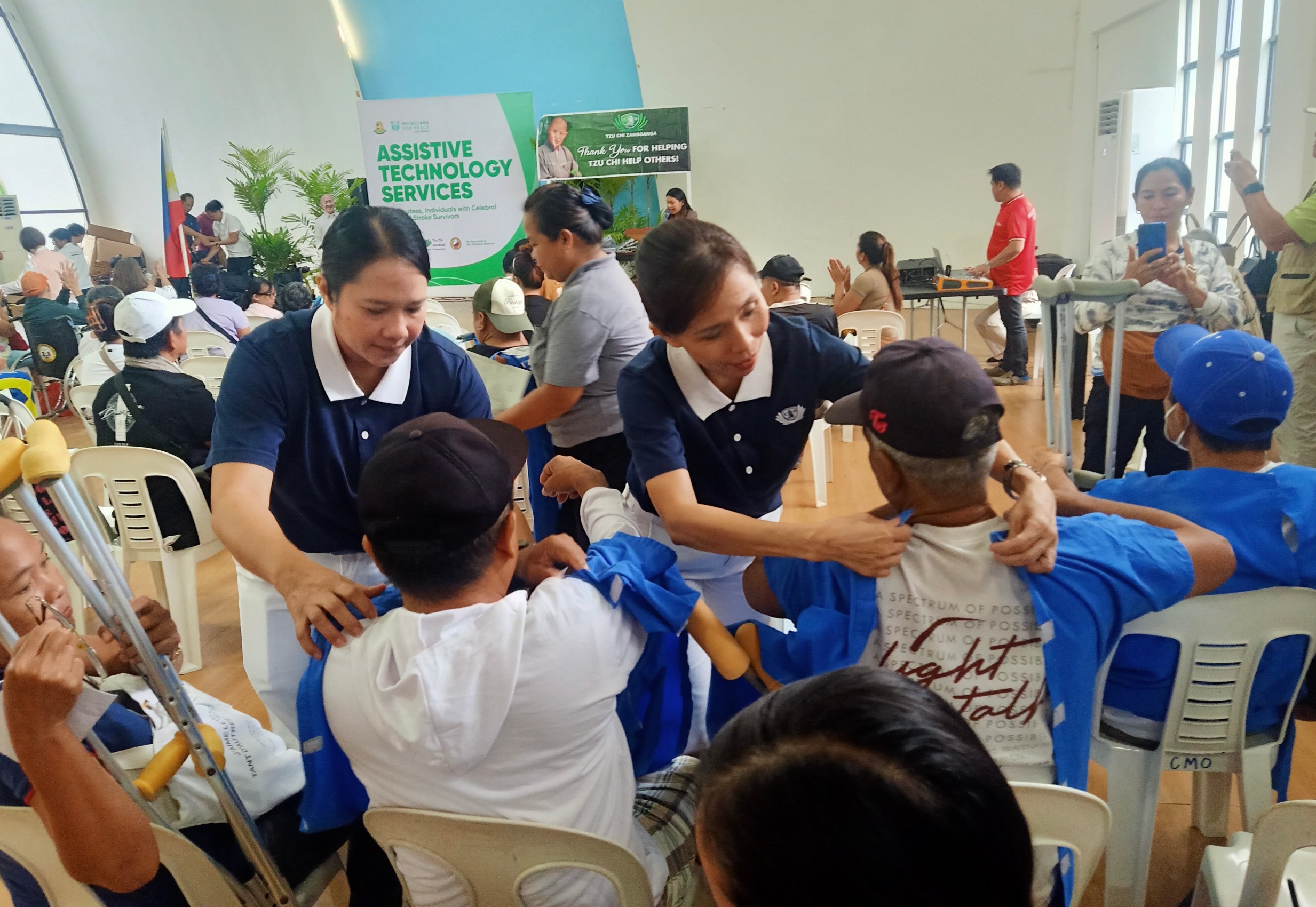 Beneficiaries are garbed in hospital gowns before they receive their prosthesis. 