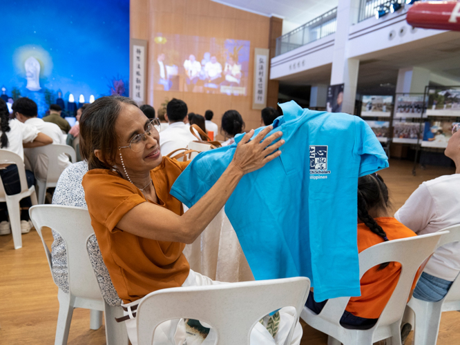 Gelly Mancera, mother of Miguel Gero Mancera, has kept many mementos of her son’s scholar days, including his Tzu Chi uniform, which she proudly displays.