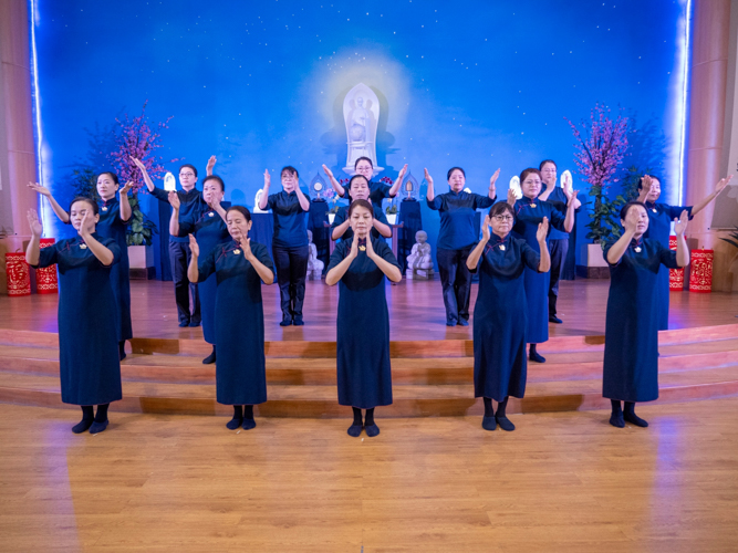 Tzu Chi commissioners perform portions of the Sutra of Immeasurable Meanings.