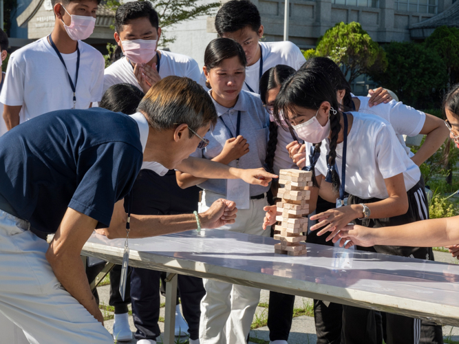 Jenga blocks are used to help build a model of the Jing Si Abode. 